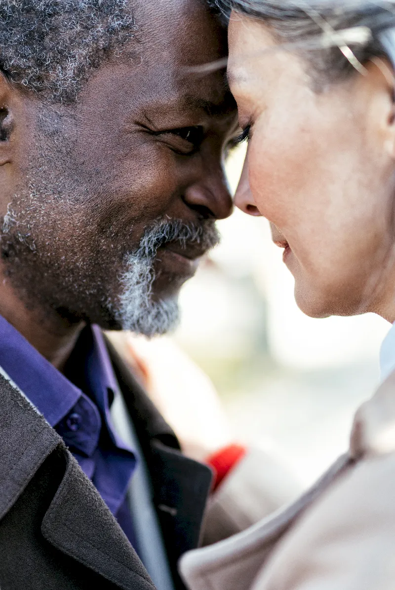 Couple embracing closely outdoors